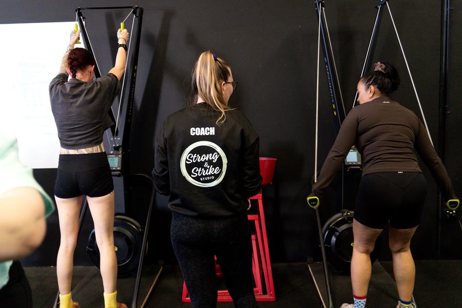 Pressing a loaded barbell overhead in the rack